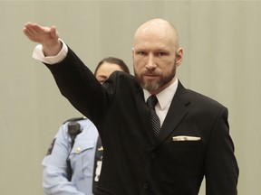 Norwegian mass murderer Anders Behring Breivik makes a Nazi salute ahead of his appeal hearing at a court at the Telemark prison in Skien, Norway on Tuesday.