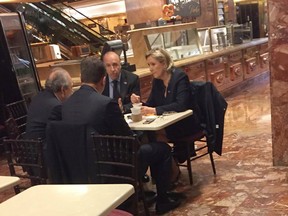 This picture distributed courtesy of the US President elect transition pool reporter Samuel Levine shows Far-right French presidential candidate Marine Le Pen (R) when spotted at Donald Trump's New York headquarters building on January 12, 2017 having coffee at Trump Ice Cream Parlor on the ground floor of Trump Tower.