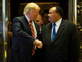 US President-elect Donald Trump shakes hands with Martin Luther King III after meeting at Trump Tower in New York City on January 16, 2017. 
The eldest son of American civil rights icon Martin Luther King Jr. met with US President-elect on the national holiday observed in remembrance of his late father.
