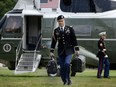 This file photo taken on May 14, 2016 shows a military aide as he carries the president's nuclear 'football'