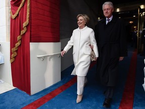 Former U.S. President Bill Clinton and First Lady Hillary Clinton arrive for the Presidential Inauguration of Donald Trump at the US Capitol in Washington, DC, January 20, 2017