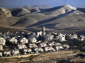 A picture taken on January 23, 2017 from Jerusalem shows the Israeli settlement of Maale Adumim in the Palestinian West Bank with the Judean desert in the background.