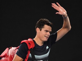Canada's Milos Raonic waves to the crowd after his defeat against Spain's Rafael Nadal during their men's singles quarter-final match on day ten of the Australian Open tennis tournament in Melbourne on January 25, 2017.