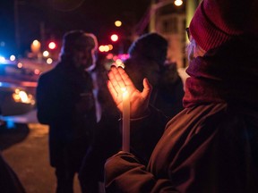People come to show their support after a shooting occurred in a mosque at the QuÈbec City Islamic cultural center on Sainte-Foy Street in Quebec city on January 29, 2017