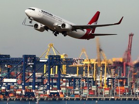 A Qantas Airways plane takes off at Sydney Airport in Sydney, Australia, on June 22, 2015.