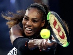 Serena Williams makes a backhand return in the Australian Open women's singles final on Jan. 28.