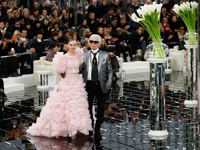 Lily-Rose Depp and Karl Lagerfeld walk the runway during Chanel's Haute Couture Spring 2017 collection show, part of Paris Fashion Week on January 24, 2017 in Paris, France.