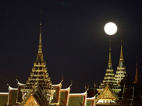 The Grand Palace complex, pictured, houses Thailand’s most sacred temple, Wat Phra Kaew, or Temple of the Emerald Buddha, with sparkling, gold-decked buildings.