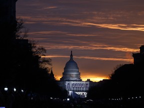 The Capitol Building is illuminated against the sunrise before the presidential inauguration of President-elect Donald Trump, Friday, Jan. 20, 2017, in Washington.