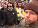 A man talks to Rebel TV reporter Sheila Gunn Reid at a women's march in Edmonton on Jan. 21, moments before he allegedly assaulted her.