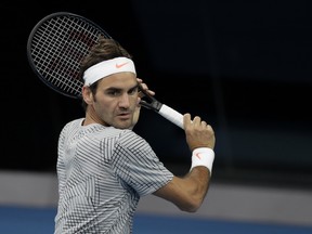 Switzerland's Roger Federer makes a backhand return during a practice session ahead of the Australian Open tennis championships in Melbourne, Australia, Sunday, Jan. 15, 2017.