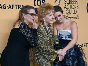 Actresses Carrie Fisher, Screen Actors Guild Life Achievement Award recipient Debbie Reynolds, and Billie Lourd pose in the press room during the 21st Annual Screen Actors Guild Awards at The Shrine Auditorium on January 25, 2015 in Los Angeles, California.