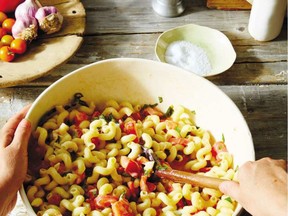 Brie melts into tomatoes to coat pasta in this easy supper dish from a new cookbook that includes shopping and cooking plans.