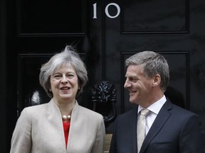 Britain's Prime Minister Theresa May greets the Prime Minister of New Zealand Bill English on the doorstep of 10 Downing Street ahead of their meeting in London, Friday, Jan. 13, 2017. (AP Photo/Frank Augstein)