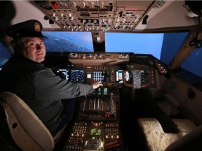 Marco Governali flies the full size Boeing 747 flight simulator he built in the basement of his Calgary home. Governali was photographed on Tuesday January 10, 2017.