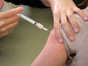 Quebec's commercial pharmacists have serviced notice that they won't vaccinate for the flu or carry out certain blood tests as of Jan. 26