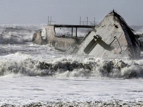 In this Saturday, Jan 21, 2017, photo, waves crash into the historic WW1-era ship called S.S. Palo Alto at Rio Del Mar in Aptos, Calif., after it was torn apart during a storm.