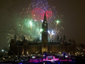 Fireworks soar over Parliament Hill to celebrate Canada's sesquicentennial.