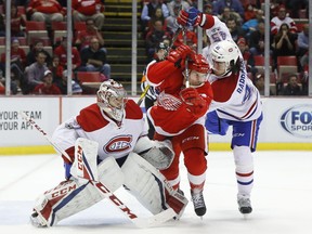 Montreal Canadiens defenceman Mark Barberio (45) defends Detroit Red Wings center Luke Glendening (41) in front of goalie Carey Price on Jan. 16.