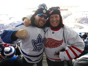 Dan Foley of Toronto, left, and John Tate of Vaughan, Ont., were in the right spirit at the Centennial Classic in Toronto on Sunday, Jan. 1, 2017.