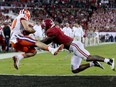 Clemson Tigers' Hunter Renfrow hauls in the game-winning touchdown against Alabama Crimson Tide defender Tony Brown with just seconds remaining in the Monday night NCAA football championship game at Tampa. Renfrow's touchdown made the final score 35-31 and avenged last year's loss to the Tide. The victory marked Clemson's first national title since 1981.