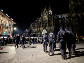 Police stand watch in front of Hauptbahnhof main railway station, where on New Year's Eve one year ago hundreds of apparently coordinated sexual assaults were perpetrated against women, prior to New Year's Eve celebrations on Dec. 31, 2016 in Cologne, Germany.