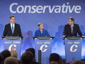 Andrew Scheer, Kellie Leitch and Brad Trost, left to right, participate in the Conservative leadership candidates' bilingual debate in Moncton, N.B. on Tuesday, Dec. 6, 2016