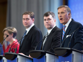Conservative leadership candidate and perceived frontrunner Maxime Bernier, right, was a favourite target of other candidates during Tuesday's debate.