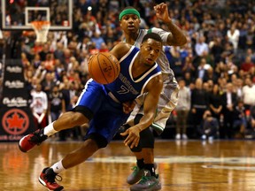 Raptors guard Kyle Lowry  gets around Isaiah Thomas of the Boston Celtics at the Air Canada Centre in Toronto on Tuesday night.