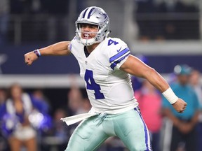 Dallas Cowboys quarterback Dak Prescott celebrates after throwing a touchdown pass against the Green Bay Packers on Jan. 15.