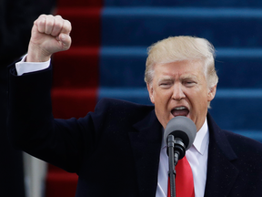 President Donald Trump pumps his fist after delivering his inaugural address on Friday.