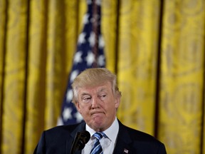 U.S. President Donald Trump pauses while speaking during a swearing in ceremony of White House senior staff in the East Room of the White House in Washington, D.C., on Sunday.