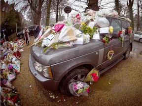 Tributes cover George Michael's SUV outside his home on Jan. 1, 2017.