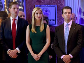 Eric, Ivanka and Donald Jr. listen to their father during a press conference January 11, 2017 at Trump Tower in New York