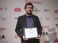 Director Hugh Gibson stands with his award for Best Canadian Film for his film "The Stairs" at the Toronto Film Critics Association Awards, on Tuesday, January 10, 2017.
