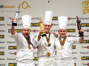 Mathew Peters of the U.S., centre, won gold at this year's Bocuse d'Or culinary competition. Christopher William Davidsen of Norway, left, won silver, and Viktor Andresson of Iceland, right, took home bronze.