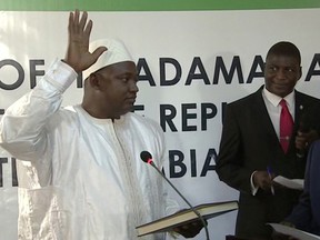 Adama Barrow is sworn in as President of Gambia at Gambia's embassy in Dakar Senegal in this image taken from TV  Thursday, Jan 19, 2017