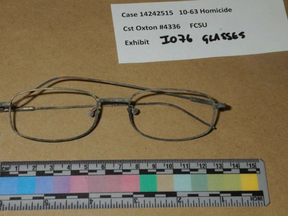 Eye glasses found in ashes at the acreage, north of Calgary, where Douglas Garland lived with his parents.