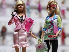 In this Feb. 14, 2010 file photo, news anchor Barbie, left, and computer engineer Barbie are arranged for a photo at the New York Toy Fair. A new study published Thursday, Jan. 26, 2017, in the journal Science suggests that girls as young as 6 can be led to believe that men are inherently smarter and more talented than women, making them less motivated to pursue novel activities and ambitious careers. That such stereotypes exist is hardly a surprise, but the findings show that the biases can affect children at a very young age.