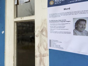 A police poster with a photo of Irma Kurowski, is photographed at the entrance of an apartment building in Berlin, Monday, Jan. 23, 2017
