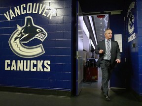 Vancouver Canucks head coach Willie Desjardins strides out of the dressing room before a game against the Nashville Predators on Jan. 17.