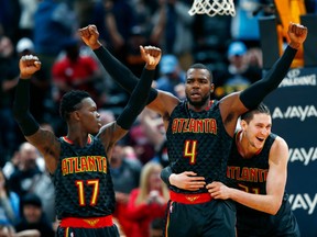 Atlanta Hawks forward Paul Millsap (centre) celebrates with guard Dennis Schroder (left) and Mike Muscala after  beating the Denver Nuggets on Dec. 23.