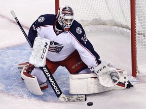Toronto Maple Leafs goaltender Curtis McElhinney makes a save during his time with the Columbus Blue Jackets on Sept. 26.