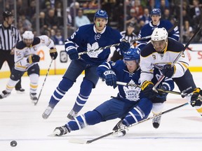 Toronto Maple Leafs defenceman Morgan Rielly (44) battles for the puck against Buffalo Sabres left wing Evander Kane (9) on Jan. 17. Rielly left the game after sustaining an injury on a later play.