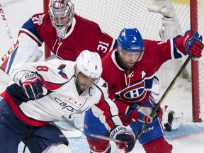 Montreal Canadiens defenceman Shea Weber takes Washington Capitals left wing Alex Ovechkin out from in front of goalie Carey Price during the first period on Monday in Montreal.