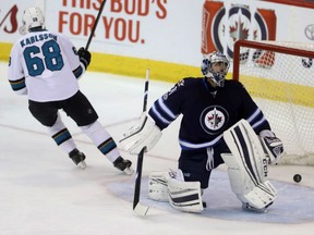 San Jose Sharks'Melker Karlsson scores on a penalty shot against Jets goalie Ondrej Pavelec during third period NHL action in Winnipeg on Tuesday night.