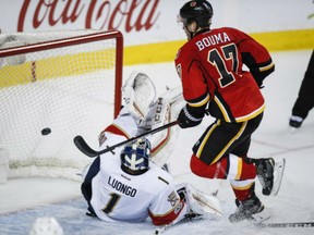 Calgary Flames' Lance Bouma  scores on Florida Panthers goalie Roberto Luongo during third period of game in Calgary on Tuesday.