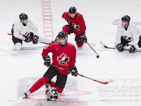 Team Canada captain Dylan Strome stretches at centre ice on Sunday, Jan. 1, 2017 during practice ahead of their quarter-final game against the Czech Republic at the world hunior hockey championship in Montreal.
