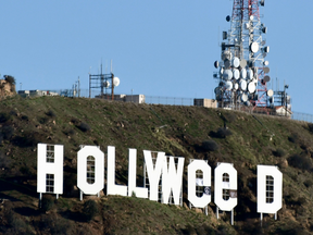 The famous Hollywood sign reads "Hollyweed" after it was vandalized, Jan. 1, 2017.