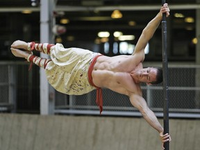 Dominic Lacasse, world record holder for the Human Flag, performs at the CNE.